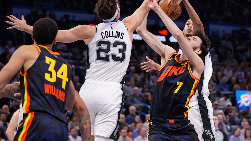 San Antonio Spurs center Victor Wembanyama, back right, blocks a shot by Oklahoma City Thunder...