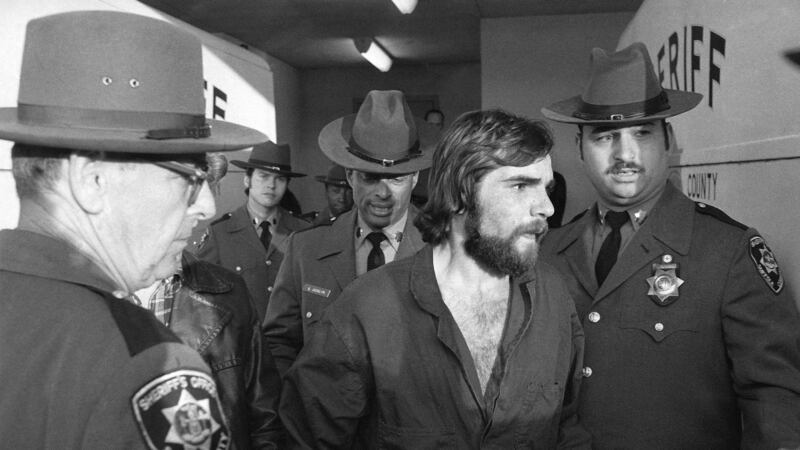 In this Nov. 15, 1974 file photo, Ronald DeFeo Jr., center, leaves Suffolk County district...