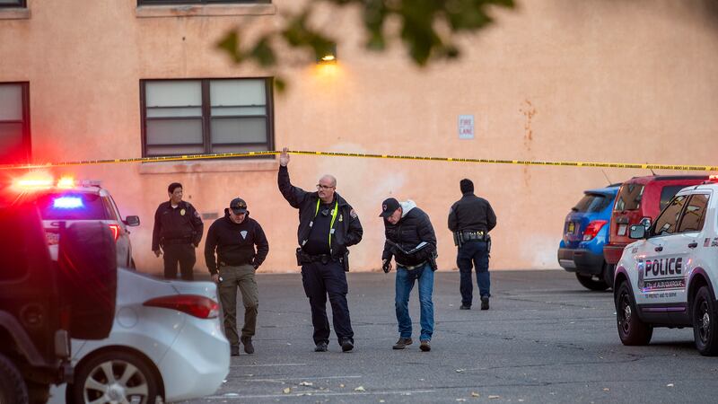 New Mexico State Police assists APD officers in investigating a deadly overnight shooting at...