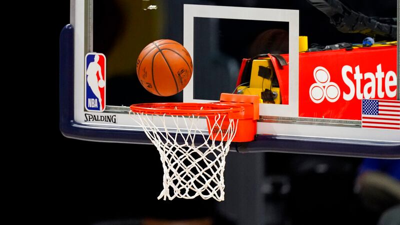 Shot falls through the hoop in the second half of an NBA basketball game Friday, Feb. 12,...