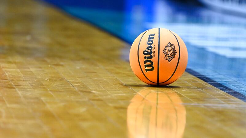 An NCAA basketball with the Final Four logo on it rests on the court during a first-round NCAA...
