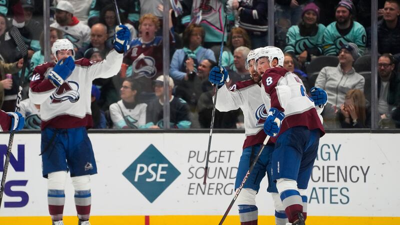 Colorado Avalanche defenseman Cale Makar (8) celebrates his goal against the Seattle Kraken...