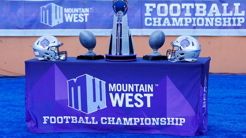 The Mountain West championship trophy, center, awaits the winner of an NCAA college football...