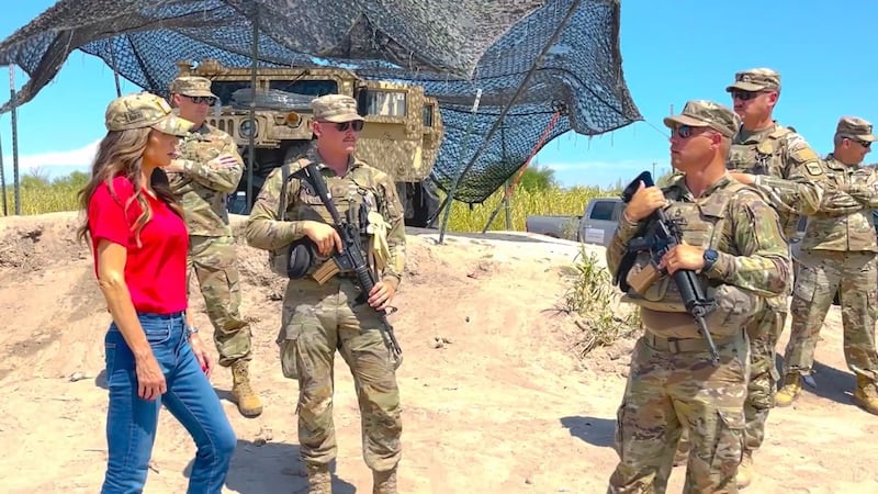 South Dakota Gov. Kristi Noem talks with state National Guard soldiers deployed at the...