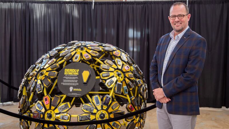 Department of Public Safety Secretary Craig Price unveils a distracted driving sculpture in...