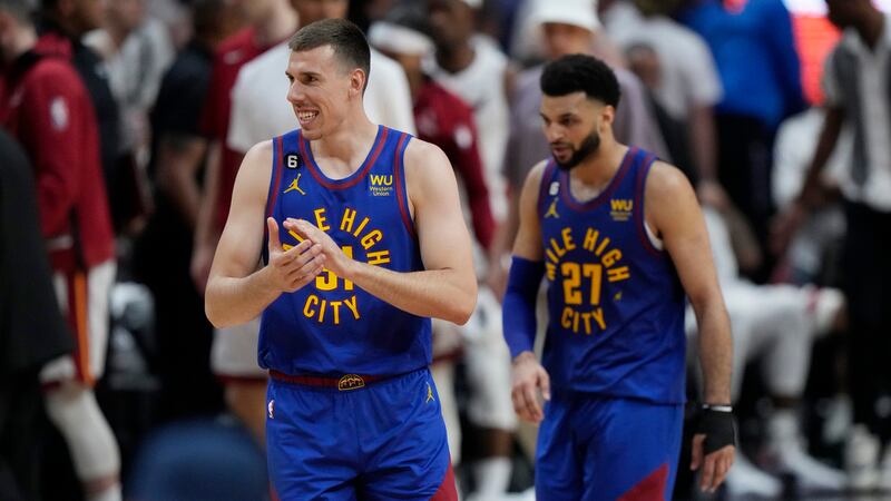 Denver Nuggets forward Vlatko Cancar (31) and guard Jamal Murray (27) smile during the second...